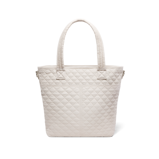 Cream quilted tote bag with soft, warm off-white color displayed against a white background, shown from the back view.