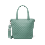 Sage green quilted tote bag with dual handles and detachable shoulder strap, front view