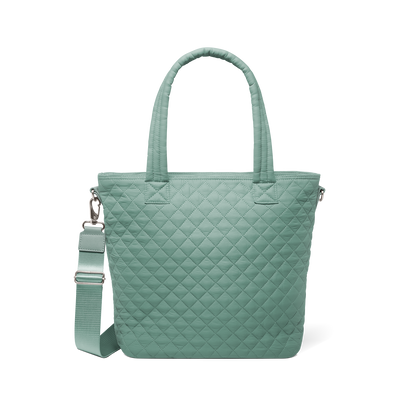Sage green quilted tote bag with dual handles and detachable shoulder strap, front view