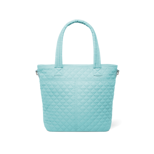 Pale turquoise quilted tote bag with diamond pattern design, shown from back view against white background