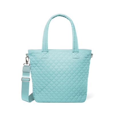 Soft aqua mint green tote bag with silver metal hardware and handles, front view