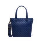 Navy blue tote bag with carabiner clip and metal hardware accents on shoulder strap