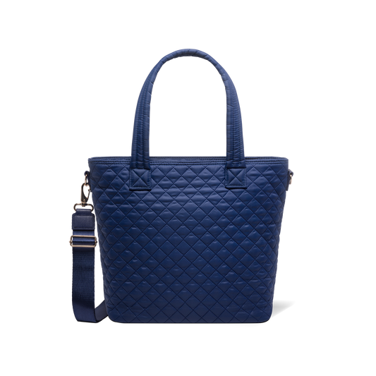 Navy blue tote bag with carabiner clip and metal hardware accents on shoulder strap