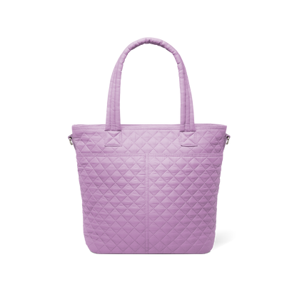 Soft mauve quilted tote bag shown from back view against white background, featuring quilted texture throughout and handles.