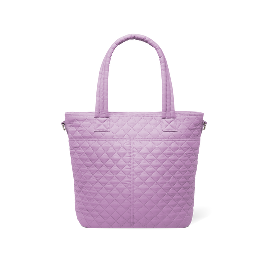 Soft mauve quilted tote bag shown from back view against white background, featuring quilted texture throughout and handles.