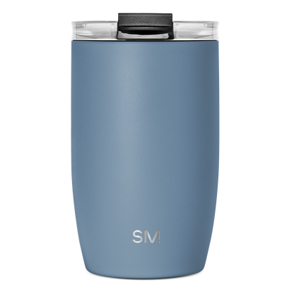 Slate blue insulated tumbler with black handle and clear glass rim, viewed from front angle