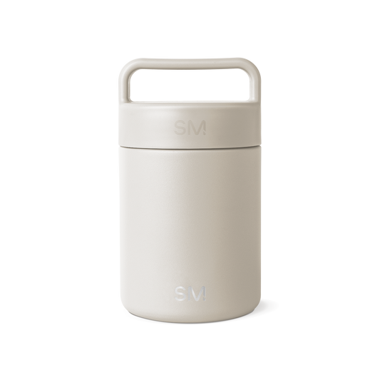 Cream-colored jar with lid on white background