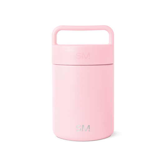 Soft pastel pink cylindrical insulated food and beverage container with removable lid and integrated carrying handle