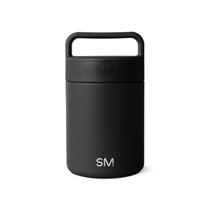 Matte black ceramic mug on white background, showcasing minimalist design and smooth finish