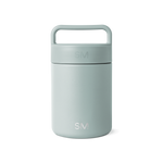 Sage green glass jar with white background, featuring a minimalist design and neutral aesthetic