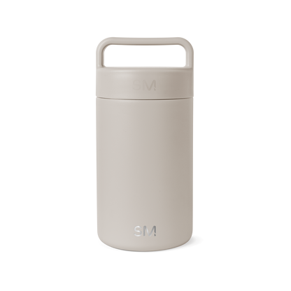 Beige cylindrical jar with matching lid on white background