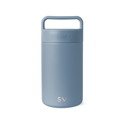 Dusty blue-gray ceramic jar with cylindrical shape and neutral muted tone on white background