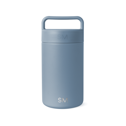 Dusty blue-gray ceramic jar with cylindrical shape and neutral muted tone on white background