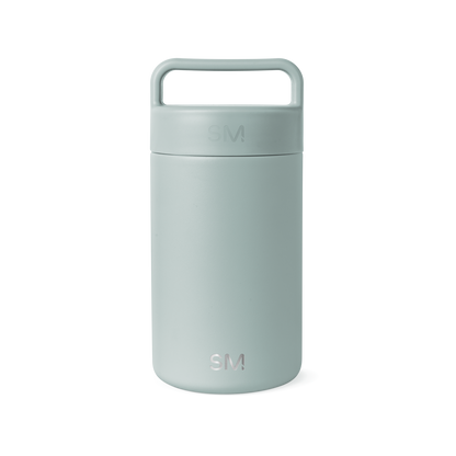 Sage green cylindrical insulated container with matte finish and integrated handle on white background
