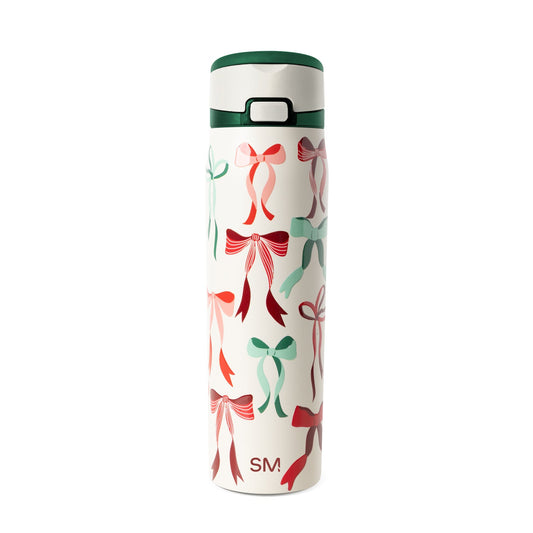Cream-colored insulated tumbler with forest green lid and handle band, featuring a modern design for hot and cold beverages.