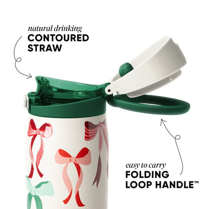 Cream-colored cookware with forest green lid and handle, featuring a vibrant red and pink decorative bow on the front.
