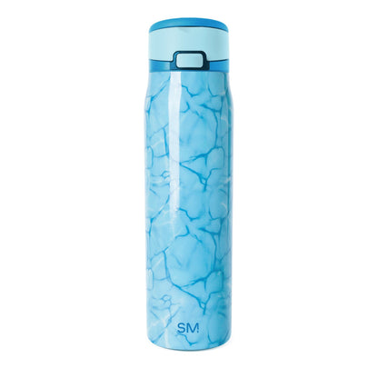 Blue stainless steel water bottle with flip-top cap and aquatic pattern design, featuring darker blue water-inspired shapes on light blue gradient background, Simple Modern SM logo visible on front.