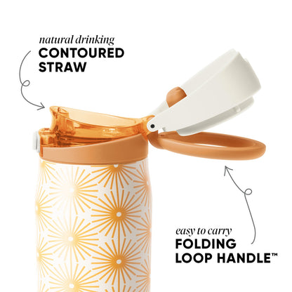 Orange and gold sunburst pattern product with radiating geometric design on white background, displayed against soft peachy tan and cream colored setting.