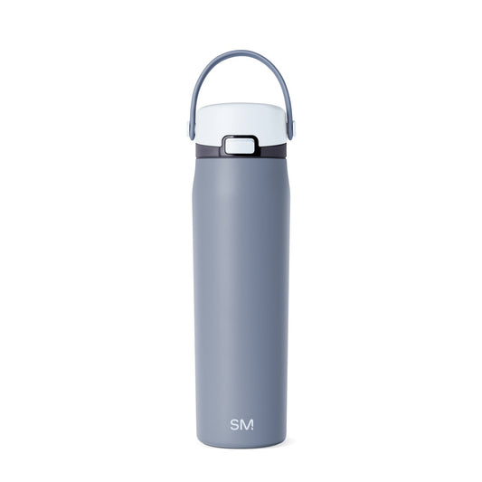 Soft slate blue insulated water bottle with white lid and cap, featuring a sleek cylindrical design for hydration and temperature retention