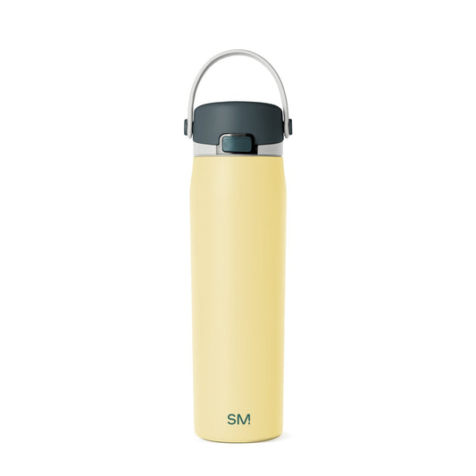 Pale butter yellow water bottle with dark charcoal gray band near the top and white or light gray accents