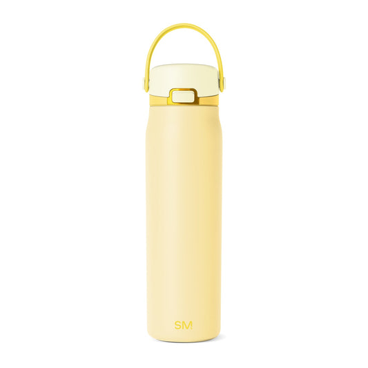Soft pale yellow and buttercream-toned product with metallic gold and brass accents for added sophistication and visual contrast.