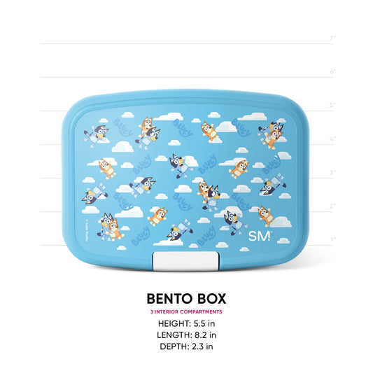 Sky blue bento box lunch container with cartoon dog and cloud illustrations on lid, white latch closure, three interior compartments. Measurements shown: 5.5" height, 8.2" length, 2.3" depth.