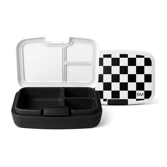 Three Simple Modern lunch containers with black and white compartmentalized bases and lids displayed against a white background. One features a checkered lid with the SM logo.