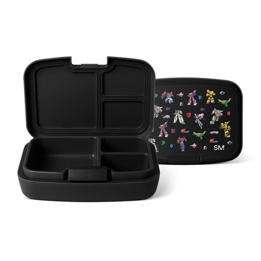 Black bento lunch box with three compartments, open to show interior dividers. Matching lid features colorful robot and transformer character illustrations on dark background. Simple Modern logo visible.