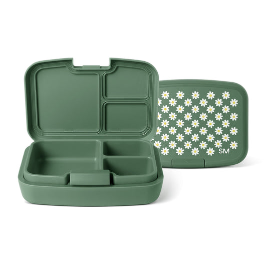 Sage green Simple Modern bento lunch box shown open and closed, displaying four interior compartments with white daisy pattern on lid and SM logo.
