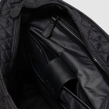 Black and charcoal gray messenger bag interior showing black fabric lining with subtle shadows and light gradations creating depth