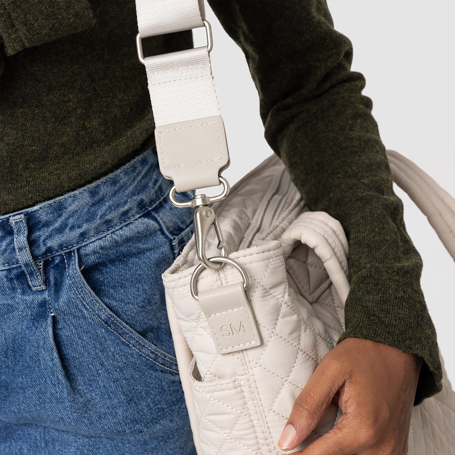 Quilted Harper bag in cream, olive green, and medium blue denim with earth-tone and neutral color palette