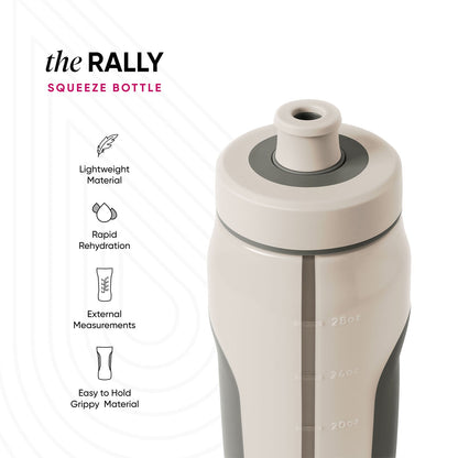 Cream-colored squeeze bottle with sage green and charcoal gray accents on neutral beige background