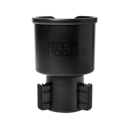 Black matte travel mug with front opening lid displayed against white background