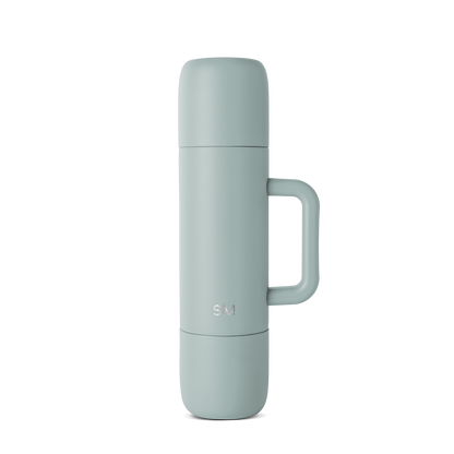 Soft sage green thermos with muted blue-green tone, displayed against neutral background. Front-facing product view showing cylindrical shape with clean, minimalist design.