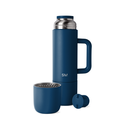 Navy blue romertopf clay baker with stainless steel silver handles and lid knob, displayed against a white background.