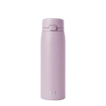Soft mauve glass bottle with dusty lilac coloring displayed against a neutral off-white background