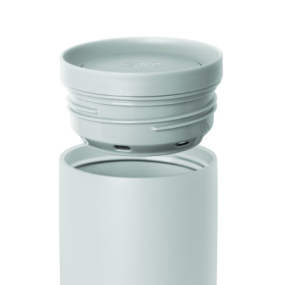 Soft sage green container with matching lid featuring subtle color variations in pale seafoam and celadon tones