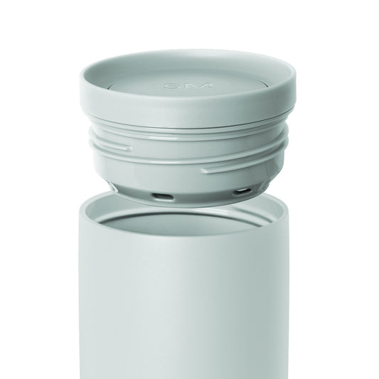 Soft sage green container with matching lid featuring subtle color variations in pale seafoam and celadon tones