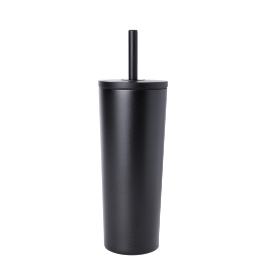 Matte black reusable cup with matching black straw on white background