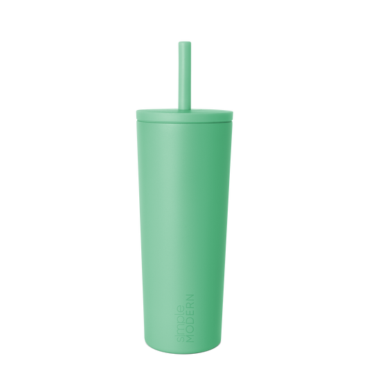Pale mint green tumbler with lid on white background