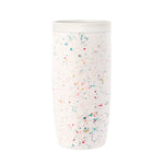 White cylindrical tumbler with colorful confetti speckle pattern throughout, product shot on neutral background