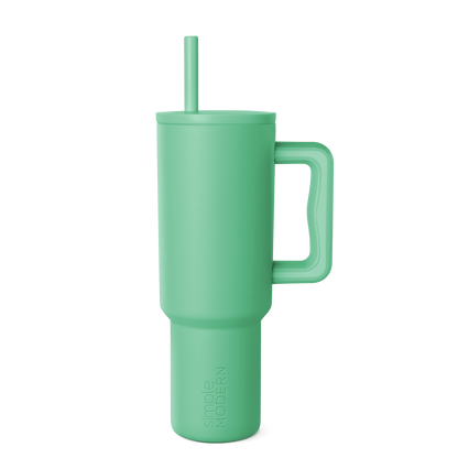 Soft sage green tumbler with clean background, modern muted celadon color throughout, calming aesthetic design