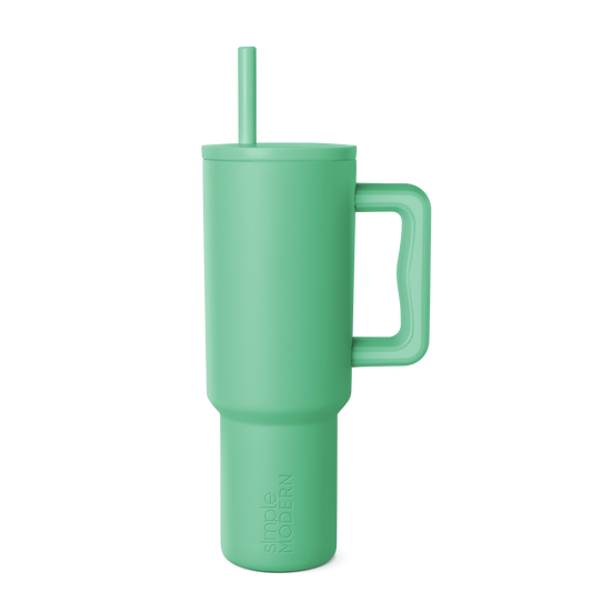 Soft sage green tumbler with clean background, modern muted celadon color throughout, calming aesthetic design