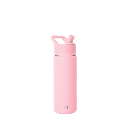 Soft pastel pink water bottle against a light gray background