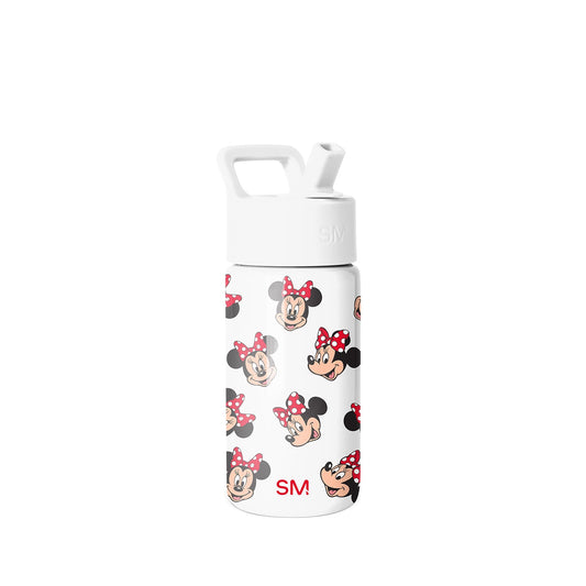 White Simple Modern water bottle with flip-top lid and carrying handle, decorated with repeating Minnie Mouse character faces featuring red bows with white polka dots, displayed on neutral background.