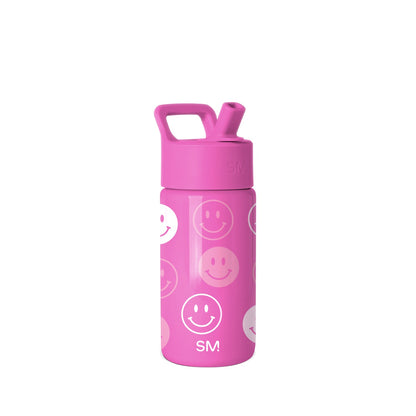 Hot pink Simple Modern water bottle with square carry handle and flip-top spout, featuring repeating white and semi-transparent smiley face pattern throughout the cylindrical body against white background.