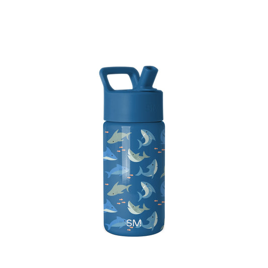 Navy blue insulated water bottle with integrated carry handle and flip-top spout, featuring playful illustrated sharks, whales, and fish in cream and orange accents. Simple Modern brand logo visible.