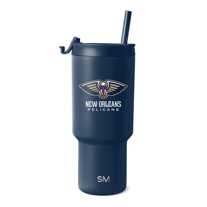 Navy blue drinkware with gold and cream logo accents, white text details