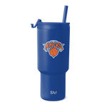 Royal blue tumbler with New York Knicks logo featuring orange and white design accents