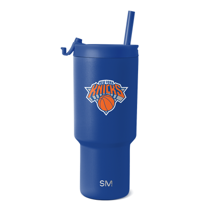 Royal blue tumbler with New York Knicks logo featuring orange and white design accents